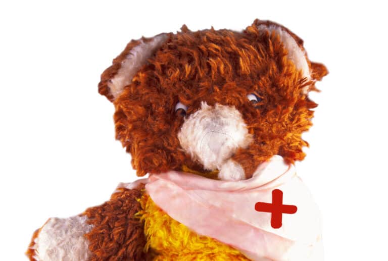 teddy bear with broken arm