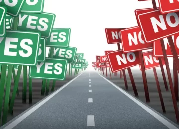 Middle of the road with conflicting opposing signs as green yes and red no demonstration placards on both sides of a neutral highway showing the concept of difficult decisions on white.