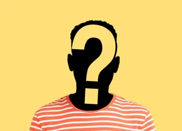 Portrait of male profile silhouette with big question mark on the head. Indoor studio shot isolated on yellow background