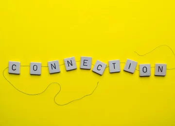 the word connection formed with the letters linked together by a thread