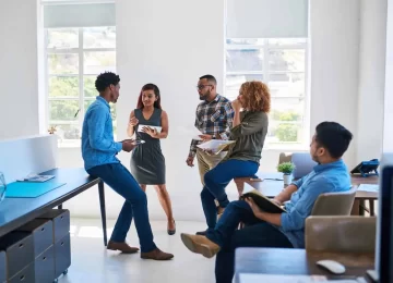 Shot of a team of young entrepreneurs having a discussion in a modern office.